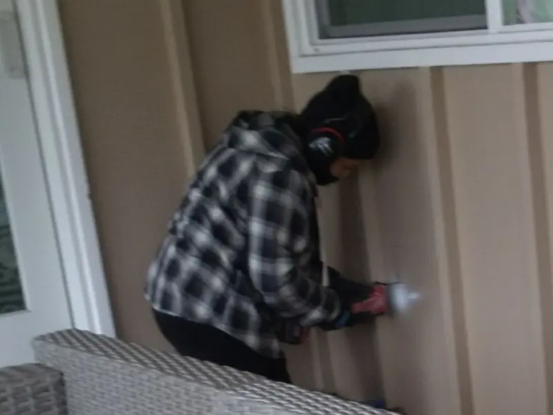 Professional electrician installing an exterior outlet in North Providence